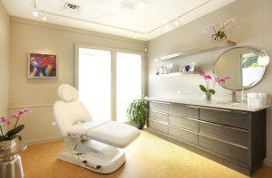 melinda menezes md is more than a medspa. We are a woman owned, physician led aesthetic medical clinic. image of treatment room and white chair.