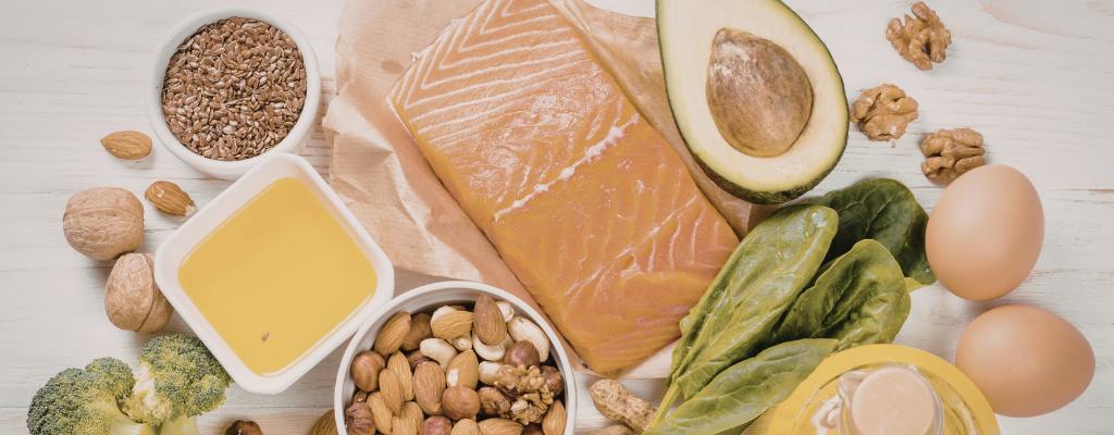 a spread of healthy protein. A piece of salmon, avocado, seeds, nuts, greens.