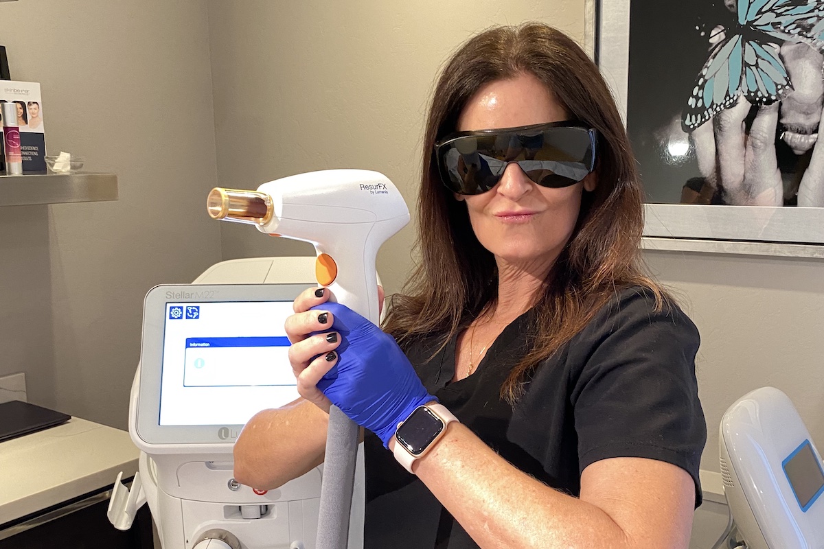 nurse angela holding a laser